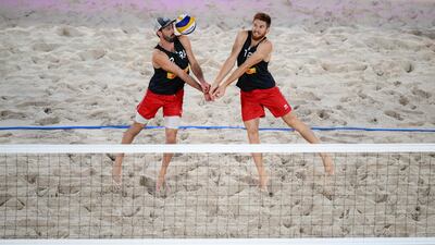 France's Julien Lyneel and Remi Bassereau return the ball to Poland's Michal Bryl and Bartosz Losiak during the volleyball Beach Pro Tour Elite 16, in Paris. AFP