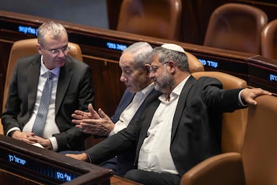 Benjamin Netanyahu, centre, is seeking to extend his term as the country's longest-serving prime minister. AFP