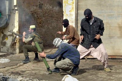 Insurgents using small arms and mortars during an attack on US forces in Fallujah, Iraq, in November 2004. AP