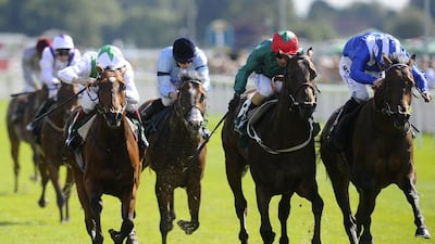 Jockey Paul Hanagan rides Muhaarar, right, to a win at the Irish Thoroughbred Marketing Gimcrack Stakes at York Racecourse in York, England. (Photo by Alan Crowhurst/Getty Images)
