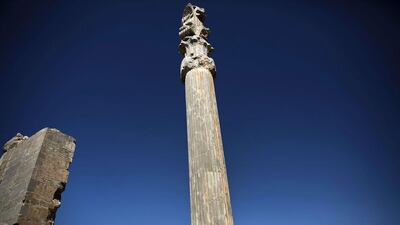 A Chinese tourist from Hong Kong poses for a picture at the "Gate of All Nations" at the ancient city of Persepolis. The cities of Isfahan, Shiraz and Yazd, all steeped in culture, are considered Iran’s top attractions. Behrouz Mehri / AFP