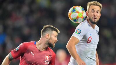 England's captain Harry Kane (R) and Czech Republic's Ondrej Celustka vie for the ball during the UEFA Euro 2020 qualifier Group A football match Czech Republic v England at the Sinobo Arena. AFP