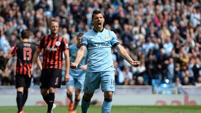 Manchester City's Sergio Aguero celebrates his third goal during their English Premier League match against Queens Park Rangers at the Etihad Stadium in Manchester, northwest England, on May 10, 2015. AFP PHOTO / OLI SCARFF