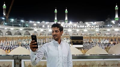 A Muslim pilgrim takes a selfie at the Grand Mosque in the holy Saudi city of Mecca. Karim Sahib / AFP Photo