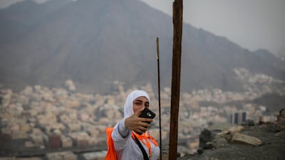 A Muslim worshipper takes selfies as she visits Mount Al-Noor. Mast Irham / EPA
