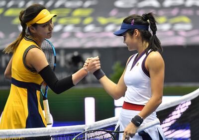 Britain's Emma Raducanu congratulates winner Wang Xinyu. AFP