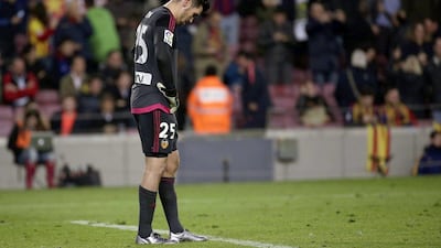 Valencia goalkeeper Matthew Ryan looks to the ground after conceding a goal. Alejandro Garcia / EPA