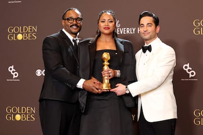 From left: Ryan Coogler, Zinzi Coogler and Sev Ohanian with their Golden Globe for Cinematic and Box Office Achievement for Sinners. AFP