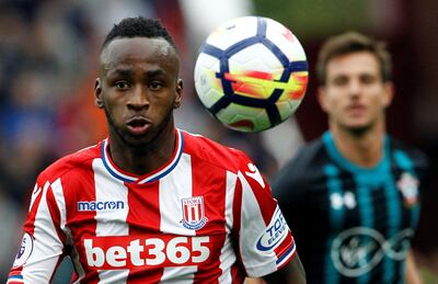 Stoke City's Saido Berahino, left, saw a first-half penalty saved by Southampton goalkeeper Fraser Forster. Craig Brough / Reuters
