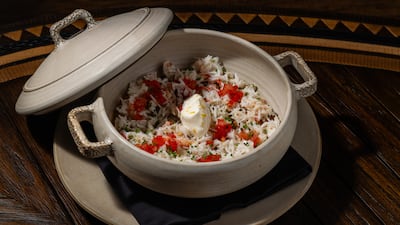 The oven-baked crab comes with Spanish rice, tomato and sour cream. Photo: Ina