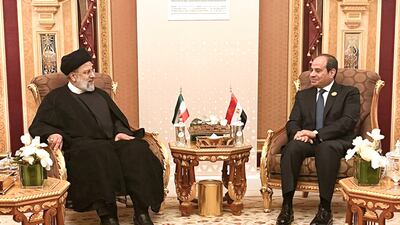 Mr Raisi, left, with Egypt's President Abdel Fatah Al-Sisi. AFP