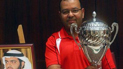 Hani Al Howri with his trophy for winning the 8-ball pool singles at the West Asian Championships.