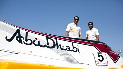 Championship power boaters Ahmed al Hameli, right, and Thani al Qamzi of Team Abu Dhabi UIM F1, stand around Thani's boat at Abu Dhabi International Marine Sports Club on Monday November 1, 2010. Andrew Henderson / The National
