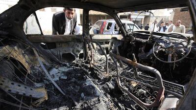 A man looks into a destroyed car at the scene of a suicide bomb attack that targeted the local court in Charsadda, Pakistan on March 7, 2016. At least eight people were killed when a suicide bomber targeted local court premises in the Shabqadar area of Charsadda district in a revenge for the execution of Mumtaz Qadri, who killed a provincial governor in 2011 in a row over blasphemy laws. Bilawal Arbab/EPA