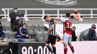 Newcastle's Fabian Schaer, left, walks off the pitch. AP