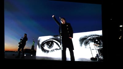 U2 appears on screen as they perform 'Get Out of Your Own Way' via satellite. Matt Sayles / Invision / AP