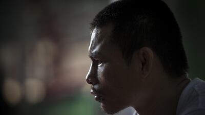 World Boxing Council (WBC) mini-flyweight champion, Wanheng Menayothin, sitting for an interview before a training session in Bangkok. Lillian Suwanrumpha / AFP