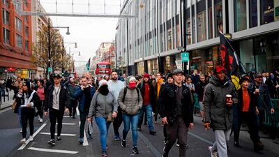 Protesters march through central London as they take part in an anti-lockdown protest against government restrictions designed to control or mitigate the spread of the novel coronavirus. AFP