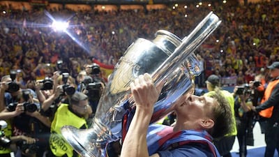 In this Saturday, June 6, 2015 file photo, Barcelona’s Lionel Messi kisses the Champions League trophy after his team defeated Juventus 3-1 in the final at the Olympic stadium in Berlin. Barcelona’s victory was its fifth and meant it became the first European team to complete the treble on two occasions. Before the final, Barcelona had secured Spain’s two main domestic competitions. (AP Photo/Martin Meissner, File)
