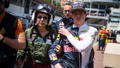 Max Verstappen is escorted by a doctor after his crash during the Monaco Grand Prix on Sunday. Andrej Isakovic / EPA