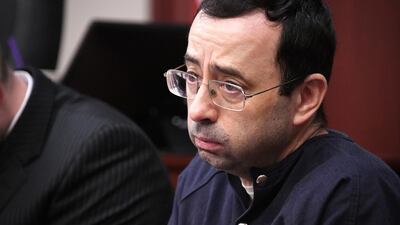 Larry Nassar looks at the gallery in the court during the sixth day of his sentencing hearing. Dale G.Young / Detroit News via AP