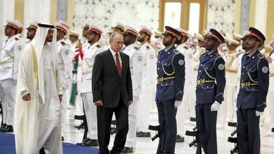 The Russian President and the Abu Dhabi Crown Prince inspect a guard of honour. Pawan Singh / The National