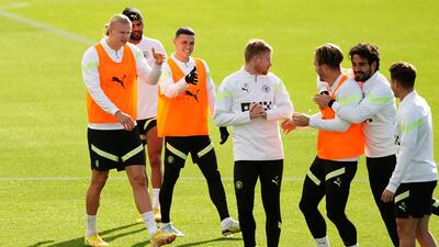 Manchester City's Erling Haaland, Riyad Mahrez, Phil Foden, Kevin De Bruyne, Jack Grealish and Ilkay Gundogan have a laugh during a training session at the City Football Academy. PA