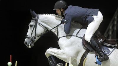 Kevin Staut and his horse Silvana clear an obstacle during the Longines FEI World Cup Jumping Final II held at the Eurexpo centre near Lyon, France, on April 19, 2014. Eddy Lemaistre/Corbis