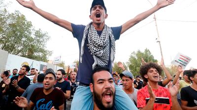 Iraqis shout slogans during protests in the southern city of Basra on August 24, 2018. AFP