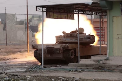 Iraqi special forces use a tank to blow up an ISIL-rigged minivan in Samah, eastern Mosul, on November 8, 2016. Florian Neuhof for The National