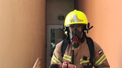 A baby is rescued from a burning third floor apartment in Discovery Gardens. Courtesy Dubai Civil Defence