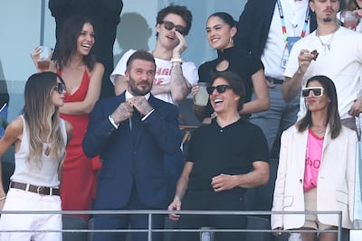 From left, Victoria Beckham, David Beckham, Tom Cruise and Jackie Apostel sat together during the match. AFP