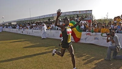 Samuel Wanjiru in 2008 crossing the finish line to win the Zayed International Marathon. Philip Cheung / Abu Dhabi Media Company