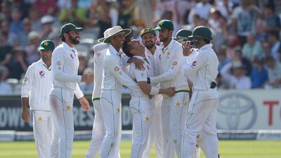 The Pakistan team celebrate after England's Johnny Bairstow was bowled out by Pakistan's Yasir Shah during Day 4 of the Test match at Lord's, London, Sunday July 17, 2016. (Anthony Devlin/PA via AP)