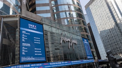 Electronic billboards display stock transactions on Exchange Square, the building housing the bourse, in Hong Kong, China. The Hang Seng Index fell to the lowest level in 14 months amid growing concerns the Omicron variant of the coronavirus will derail global economic recovery. EPA