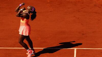 Serena Williams celebrates after winning the match point. Clive Brunskill / Getty Images
