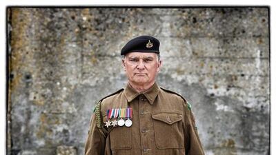 Frank Mumby, from the United Kingdom wears a replica uniform of a member of the British 53rd Welsh Reconnaissance Regiment.