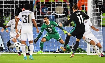 Gareth Bale, second right, scores with his first touch after coming on as a Real Madrid substitute. It would prove to be the winner. Martin Dokoupil / EPA