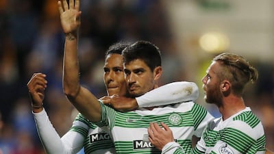 Celtic player Nir Bitton, centre, celebrates a goal during a Scottish Premier League match against St Johnstone last Wednesday. Danny Lawson / AP / August 13, 2014
