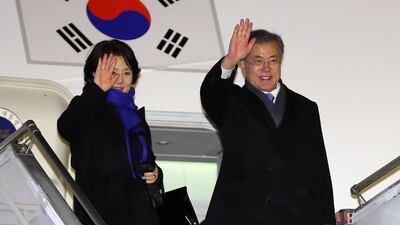 South Korean President Moon Jae-in and first lady Kim Jung-sook wave to people sending them off before leaving Prague, the Czech Republic. EPA
