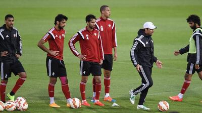 UAE coach Mahdi Ali, second right, delivers instructions to his players.