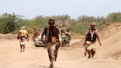 Yemeni government forces backed by the Saudi-led coalition advance during fighting against Houthi rebels on the outskirts of the port city of Hodeidah. EPA