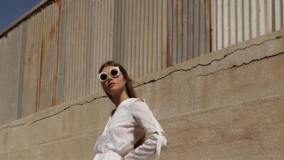 STILL LIFE: Top, Dh1,450; skirt, Dh1,295, both from Bedouin. Sunglasses, Dh1,920, Chanel. Earrings, Dh815, Elisabetta Franchi. Shoes, Dh3,410, Giuseppe Zanotti