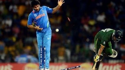 Pakistan's Yasir Arafat is run out as India's Zaheer Khan watches the bails come off. There was plenty of drama in Colombo tonight. Philip Brown / Reuters