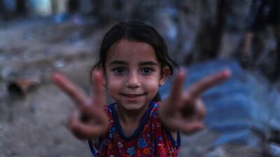 A Palestinian girl in the rubble of her family house in Beit Hanoun town, in the northern Gaza Strip. EPA