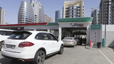 Motorists in Dubai queue up to wash their cars at the Enoc petrol station by the Greens. Razan Alzayani / The National