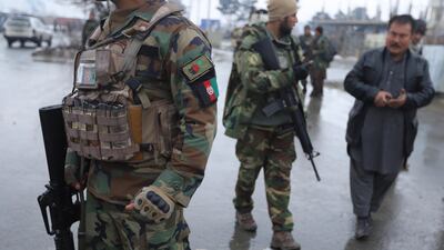 Afghan soldiers stand guard outside the Marshal Faheem Military academy, after an attack in Kabul. Jawad Jalali / EPA