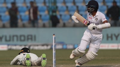 New Zealand wicketkeeper Tom Blundell dives for the ball after India's Wriddhiman Saha plays a shot. AP