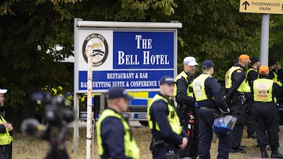 Police officers outside The Bell Hotel, in Essex, which is at the centre of the legal battle. PA Wire