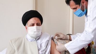 President Ebrahim Raisi of Iran receives the first dose of the country's home-grown vaccine against Covid-19 in Tehran. Reuters